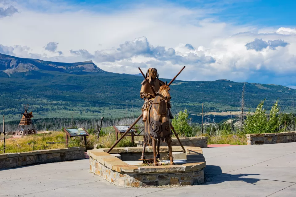 Blackfoot memorial statue in Glacier National Park of Native American sitting on horse
